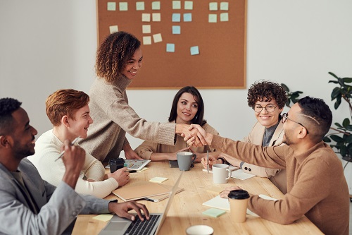 people sitting indoors discussing interpersonal skills for workplace success