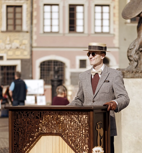 street performer standing on pavement showing factors involved in voice quality