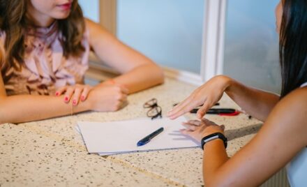 Two women chatting about skills in interview