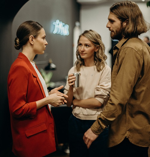 two women and man discussing Communication Skills in  CV or interview