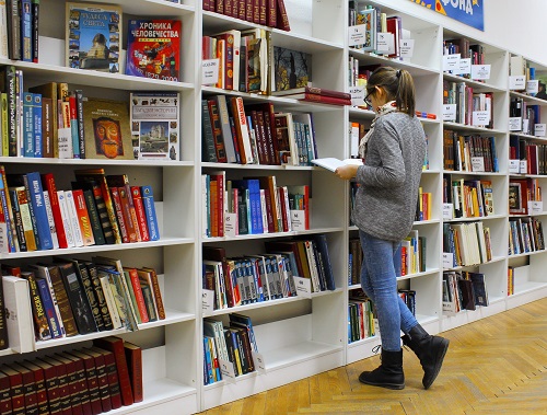 woman reading book for finding some basic principles of effective reading process