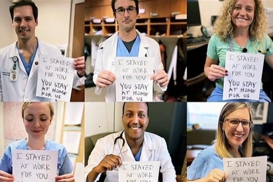 six people showing charts with instructions written for treatment of coronavirus