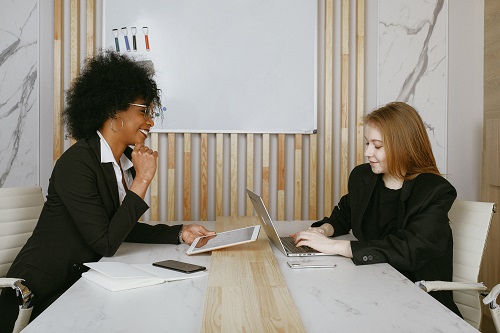 two women working types of listening skills in office