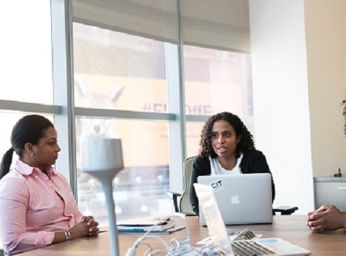 three woman discussing effective listening strategies