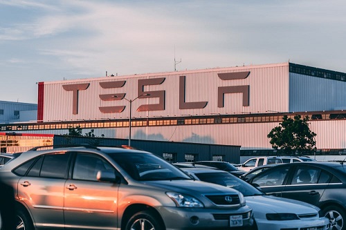 cars parked in front of a building of the best car insurance companies