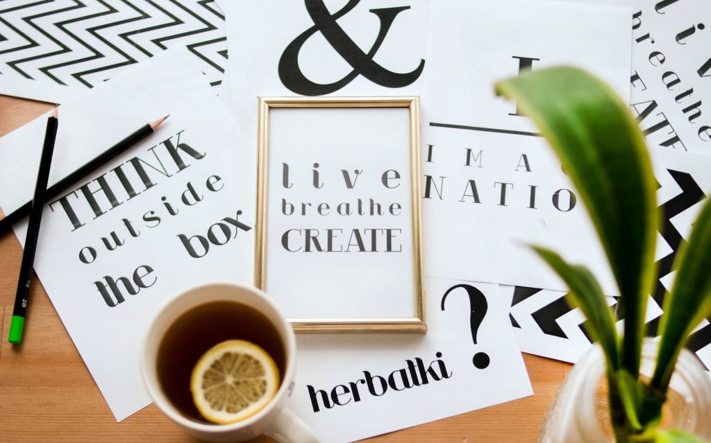 Education Trends 2020 to 2021 1 black pencils on frames and green leaves and a cup of tea showing education trends 2020 to 2021