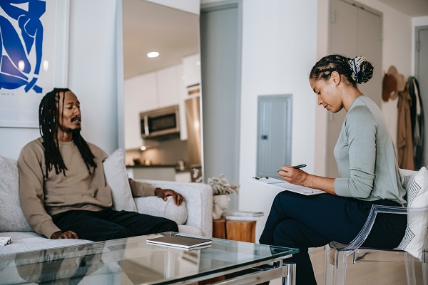 a man and a woman discussing dialogue writing