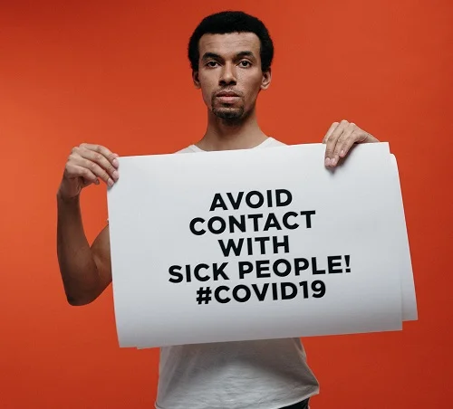 Safety Measures Against Coronavirus disease (COVID-19) | The Silent Killer | Advice for the People 4 a man holding banner showing safety measures against coronavirus
